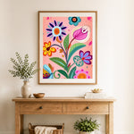Finished bold folk flower art cross stitch artwork displayed as home decor