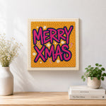 Finished bold merry xmas lettering artwork displayed on a wall
