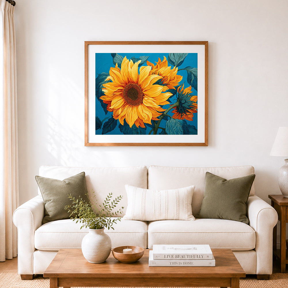 Finished bold sunflower blue backdrop cross stitch artwork displayed as home decor