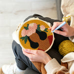 Creating handmade bold woman with pink floral crown punch needle artwork