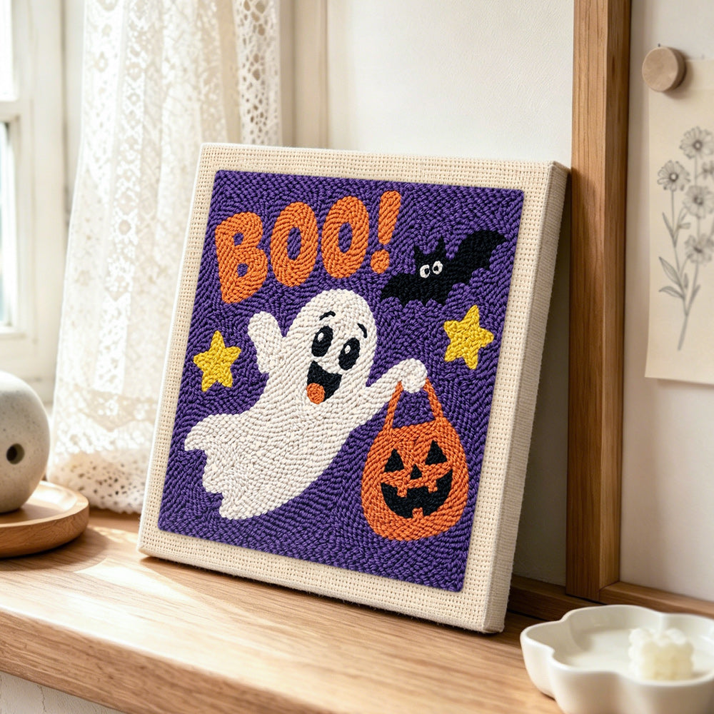 Boo ghost trick or treat punch needle artwork displayed on a table