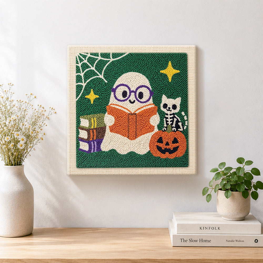Finished book‑loving ghost artwork displayed on a wall