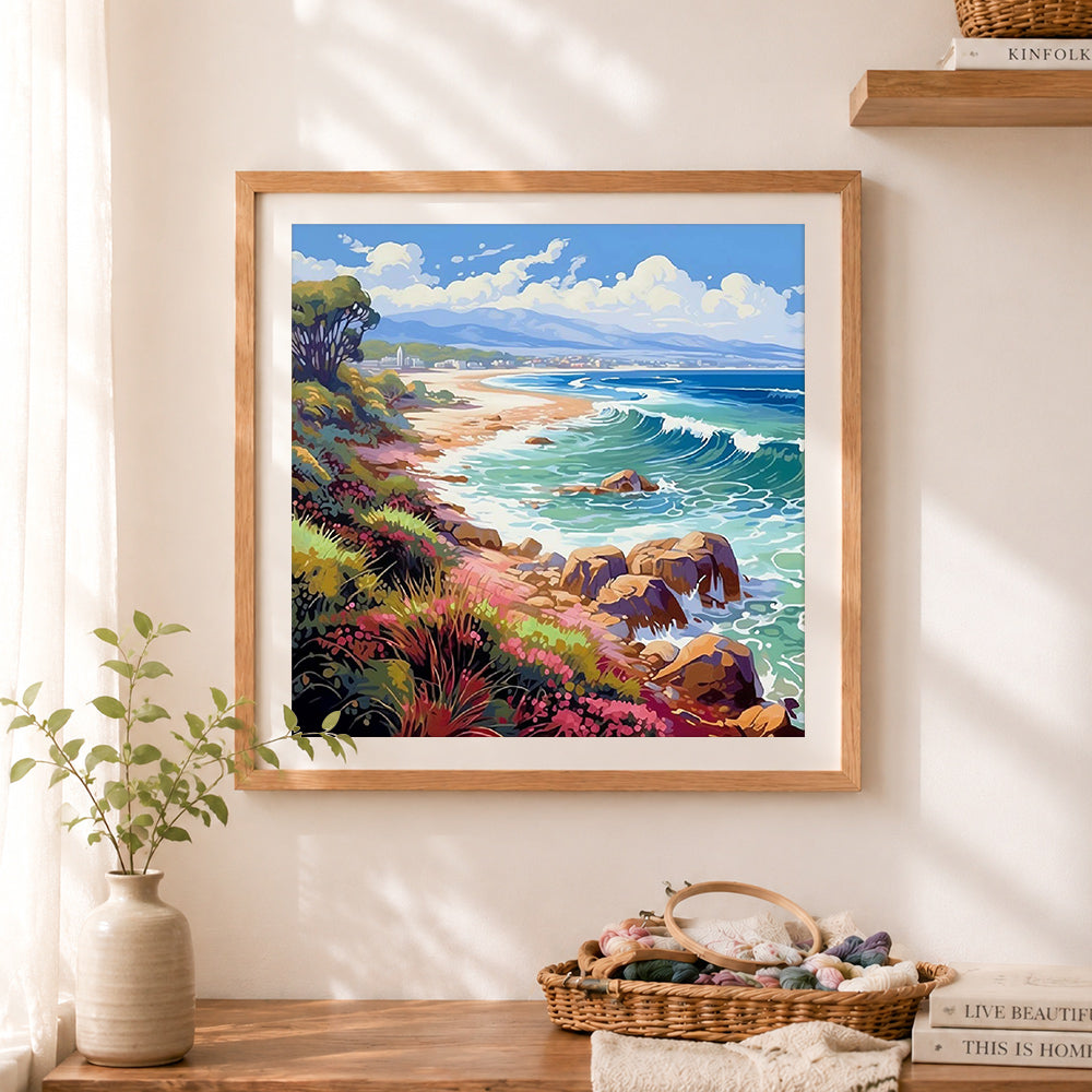 Finished bright coastal cliff scenery cross stitch artwork displayed as home decor