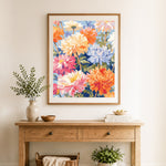 Finished bright dahlia garden cross stitch artwork displayed as home decor