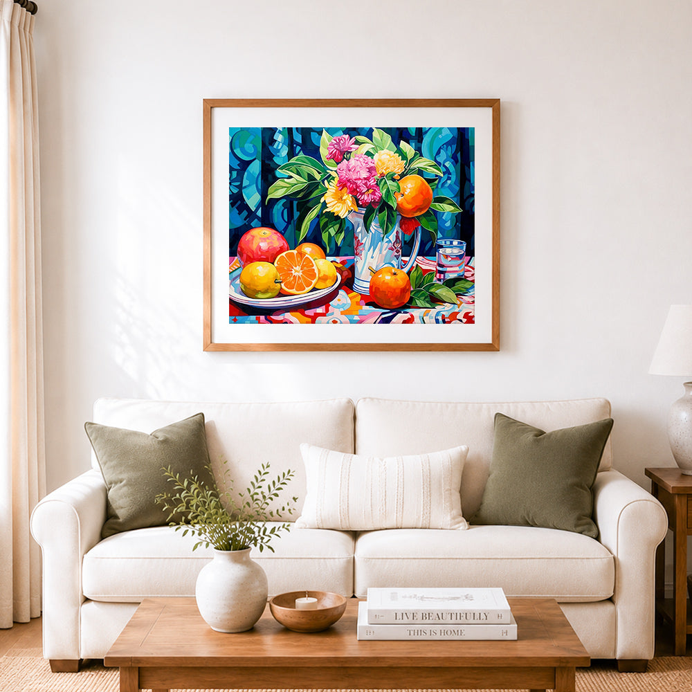 Finished bright floral and fruit still life cross stitch artwork displayed as home decor