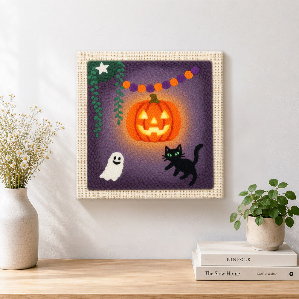 Finished bright glowing pumpkin artwork displayed on a wall