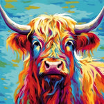 Bright highland cow against blue sky cross stitch kit for beginners