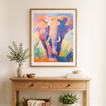 Finished bright multicolor elephant cross stitch artwork displayed as home decor