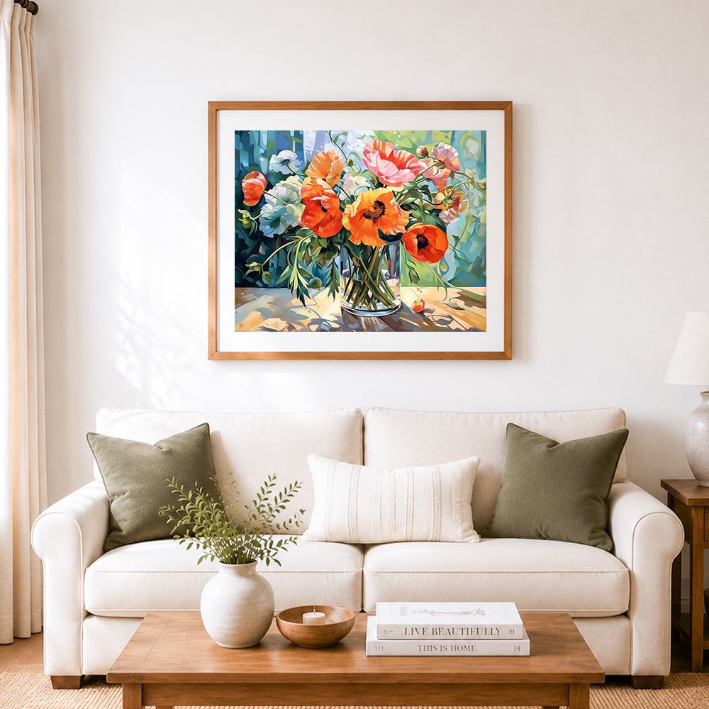 Finished bright orange and pink poppies in sunlight cross stitch artwork displayed as home decor