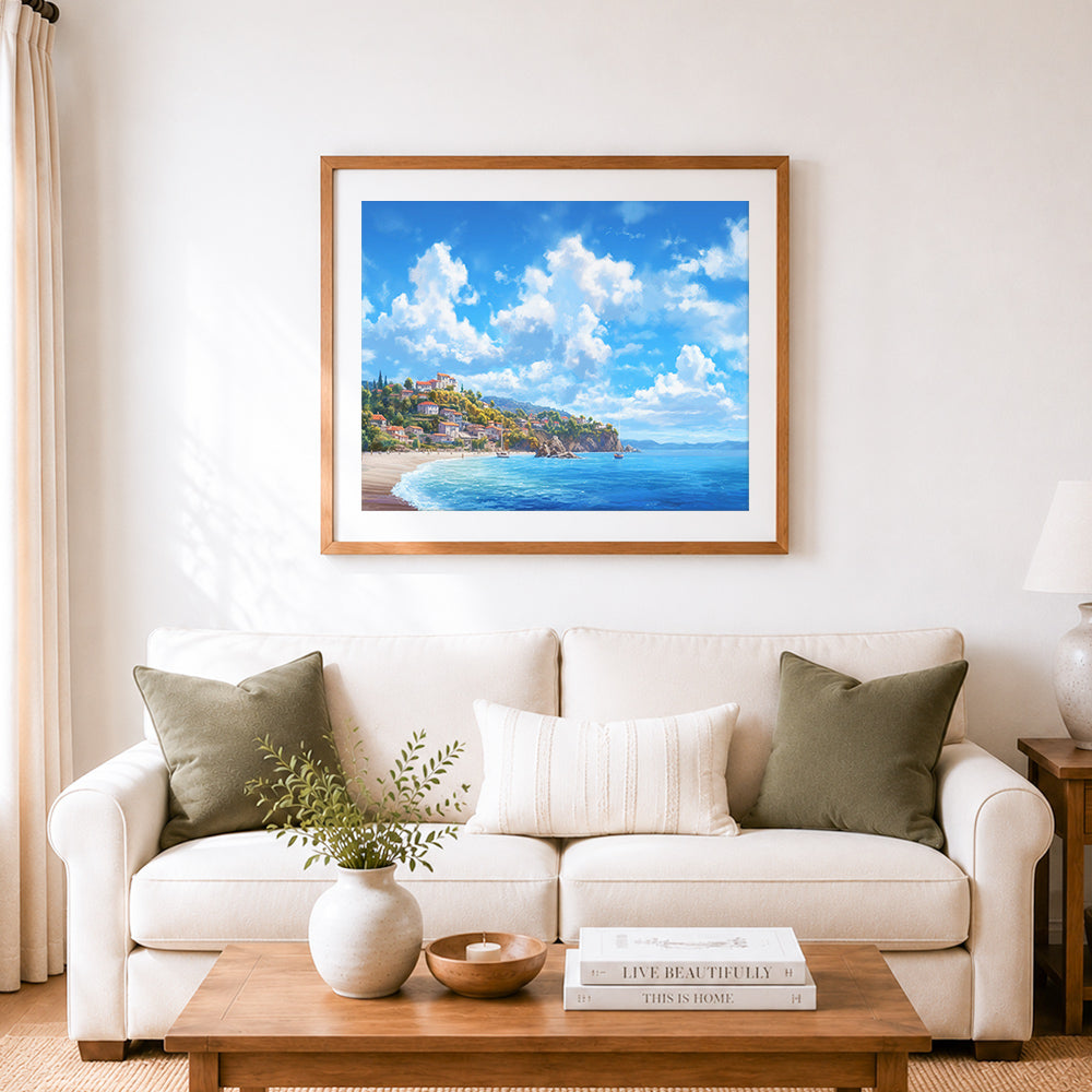 Finished bright summer coastal town cross stitch artwork displayed as home decor