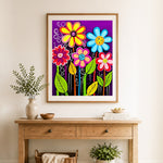 Finished bright whimsical blooms cross stitch artwork displayed as home decor