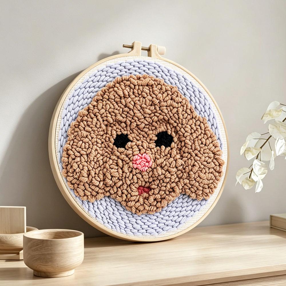 Brown puppy punch needle artwork displayed on a table