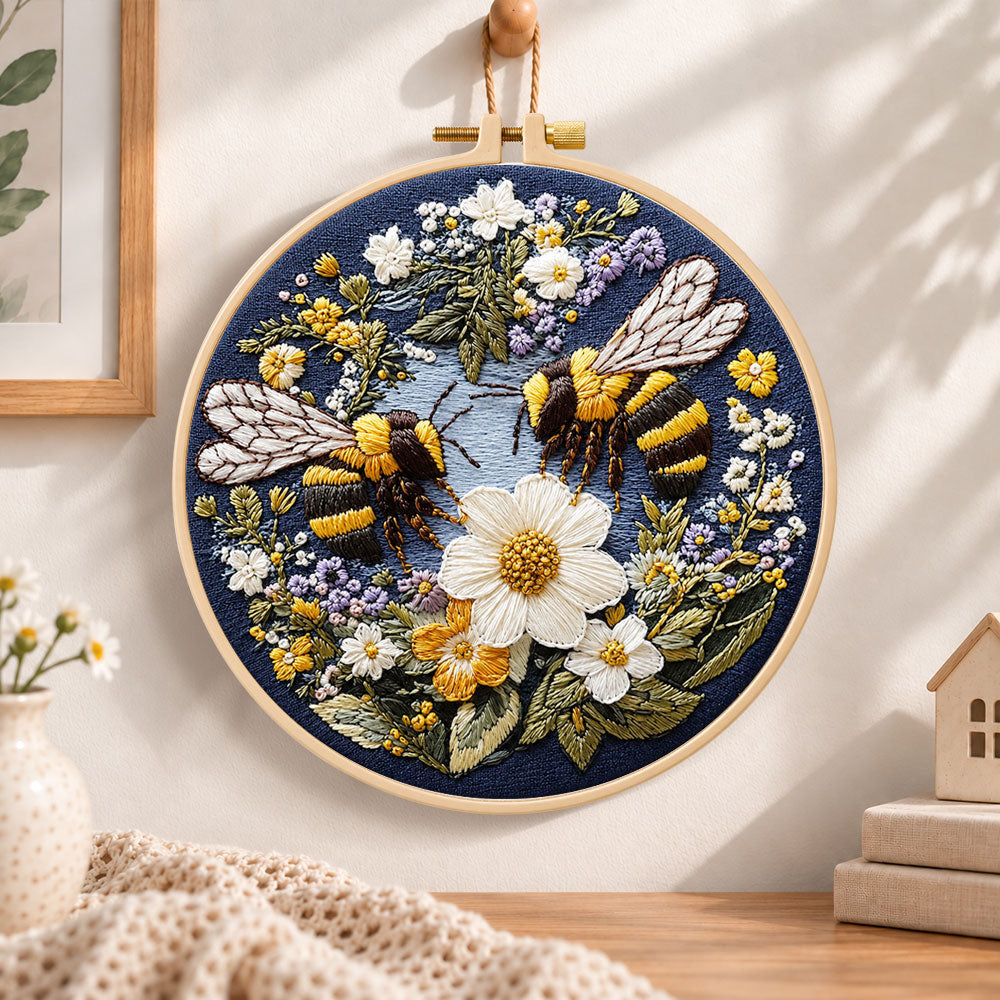 Bumblebees and white daisies embroidery hoop wall art displayed as warm and cozy handmade home decor