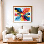 Finished burst of vibrant paint cross stitch artwork displayed as home decor