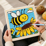 Creating handmade buzzing bee with giant sunflower punch needle artwork