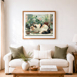 Finished calico cat sleeping on books cross stitch artwork displayed as home decor