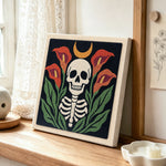 Calla lily skull punch needle artwork displayed on a table