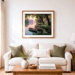 Finished calm lakeside boats cross stitch artwork displayed as home decor