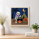 Finished camping skeleton artwork displayed on a wall