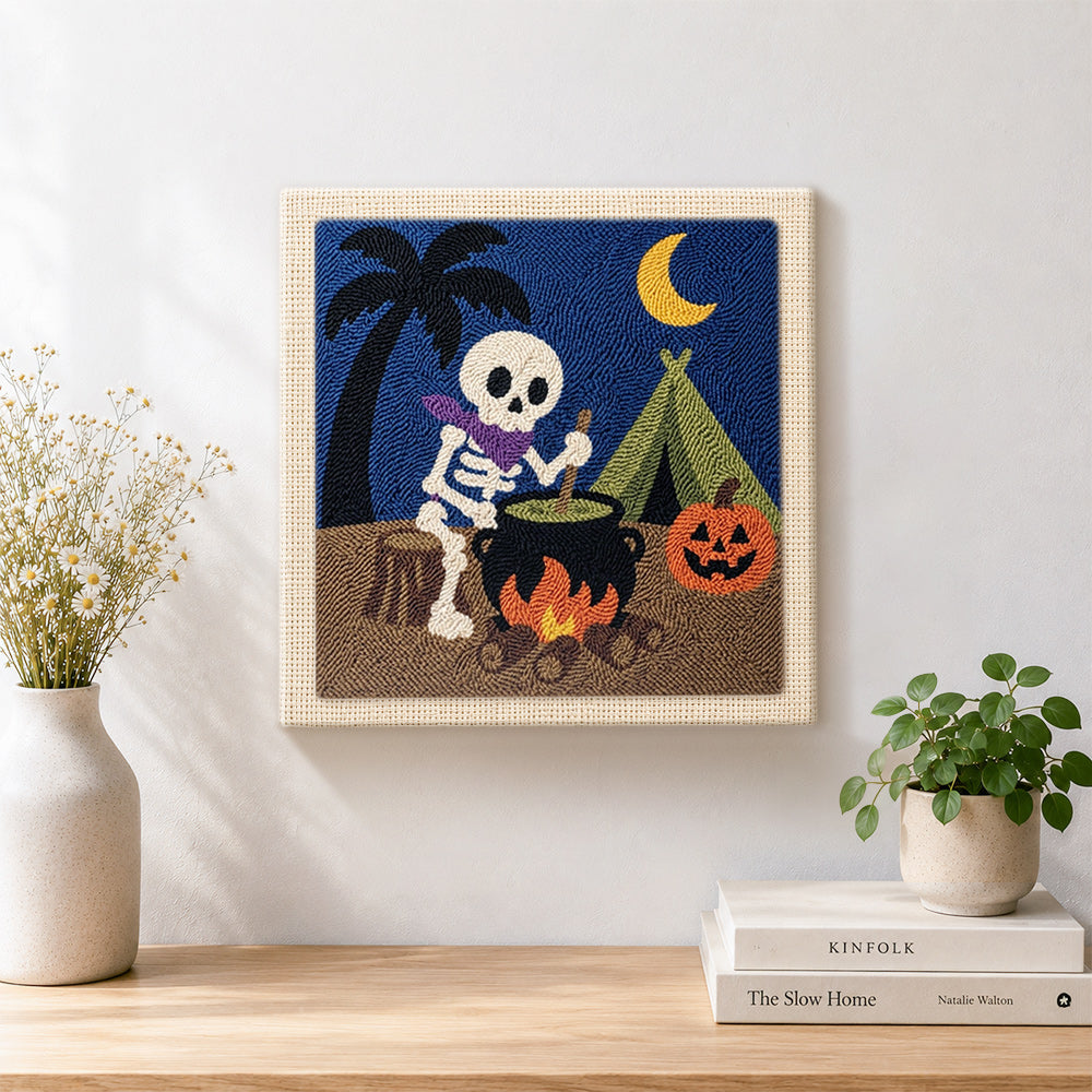 Finished camping skeleton artwork displayed on a wall