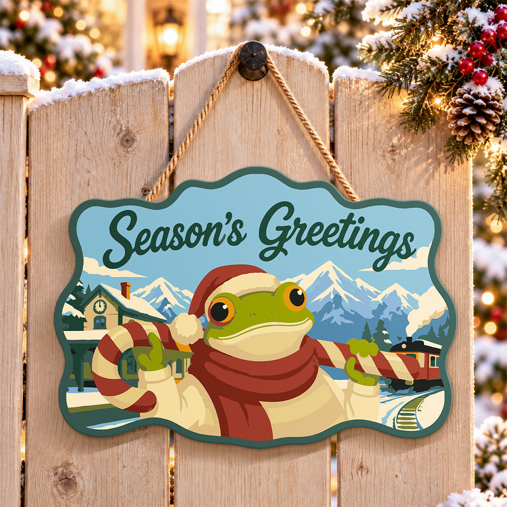 Candy cane frog greetings paint by numbers door hanger on a garden gate