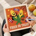 Creating handmade candy corn halloween pair punch needle artwork