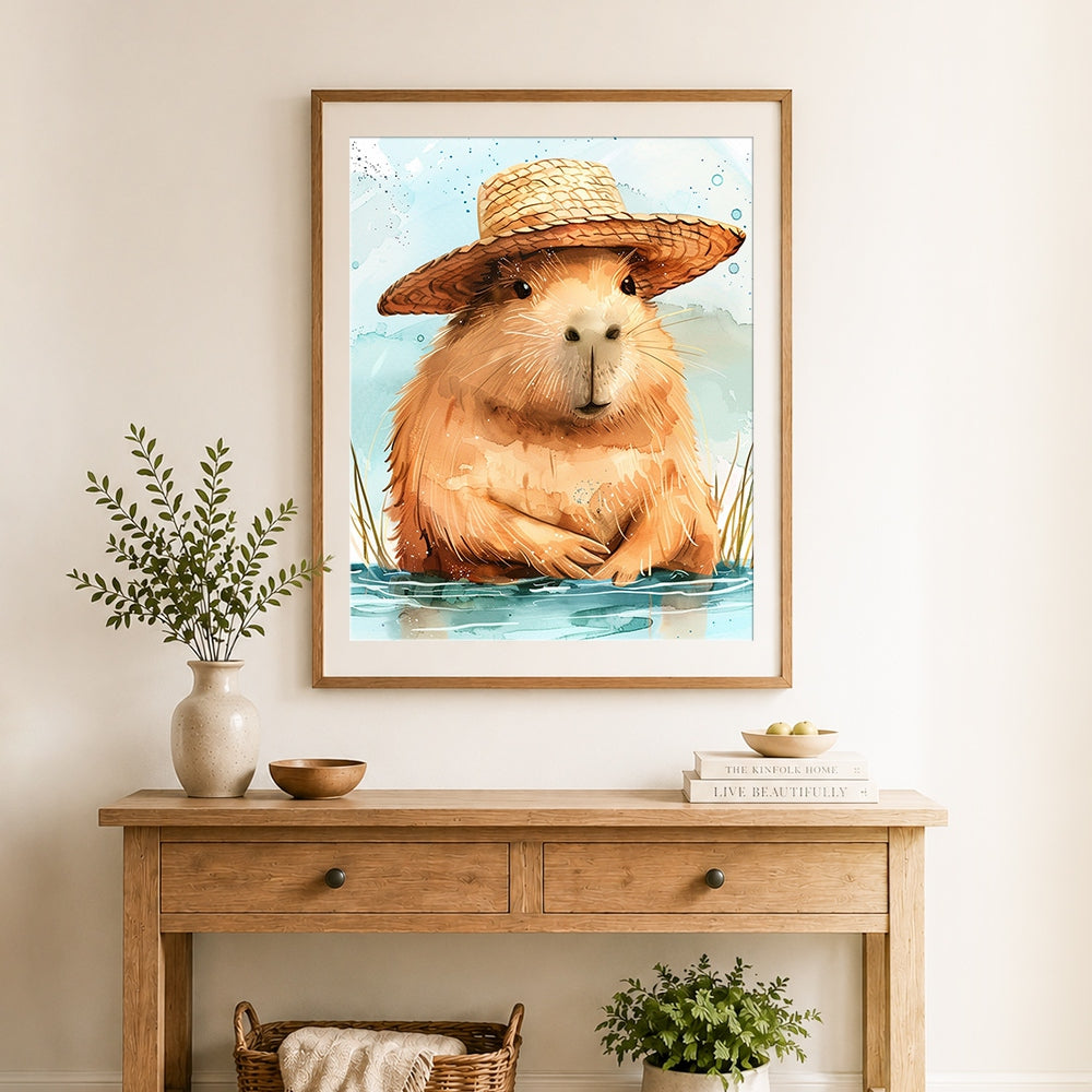 Finished capybara with straw hat cross stitch artwork displayed as home decor