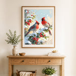 Finished cardinals on snowy berry branches cross stitch artwork displayed as home decor