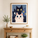 Finished cartoon cat trio cross stitch artwork displayed as home decor