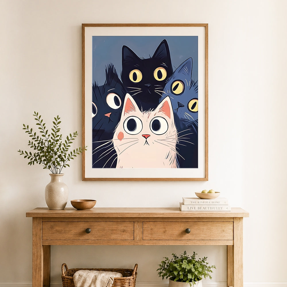 Finished cartoon cat trio cross stitch artwork displayed as home decor