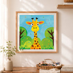 Finished cartoon smiling giraffe cross stitch artwork displayed as home decor