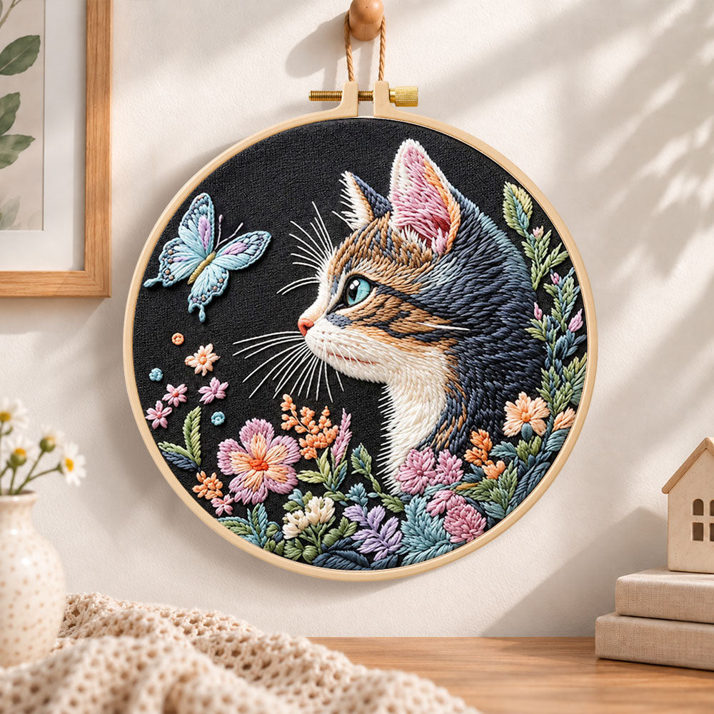 Cat and blue butterfly embroidery hoop wall art displayed as warm and cozy handmade home decor