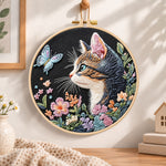 Cat and blue butterfly embroidery hoop wall art displayed as warm and cozy handmade home decor