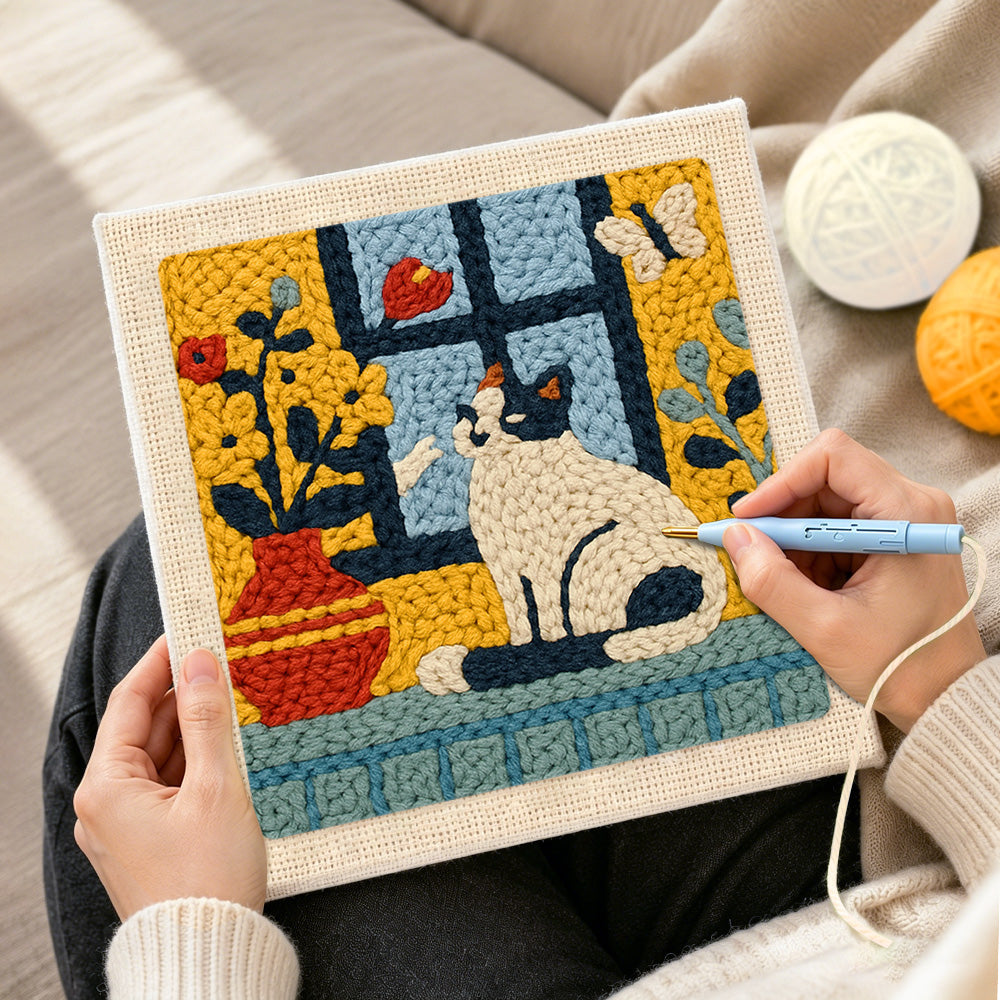 Creating handmade cat and flower vase on windowsill punch needle artwork