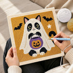 Creating handmade cat ghost with pumpkin bucket punch needle artwork