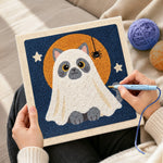 Creating handmade cat in ghost costume punch needle artwork