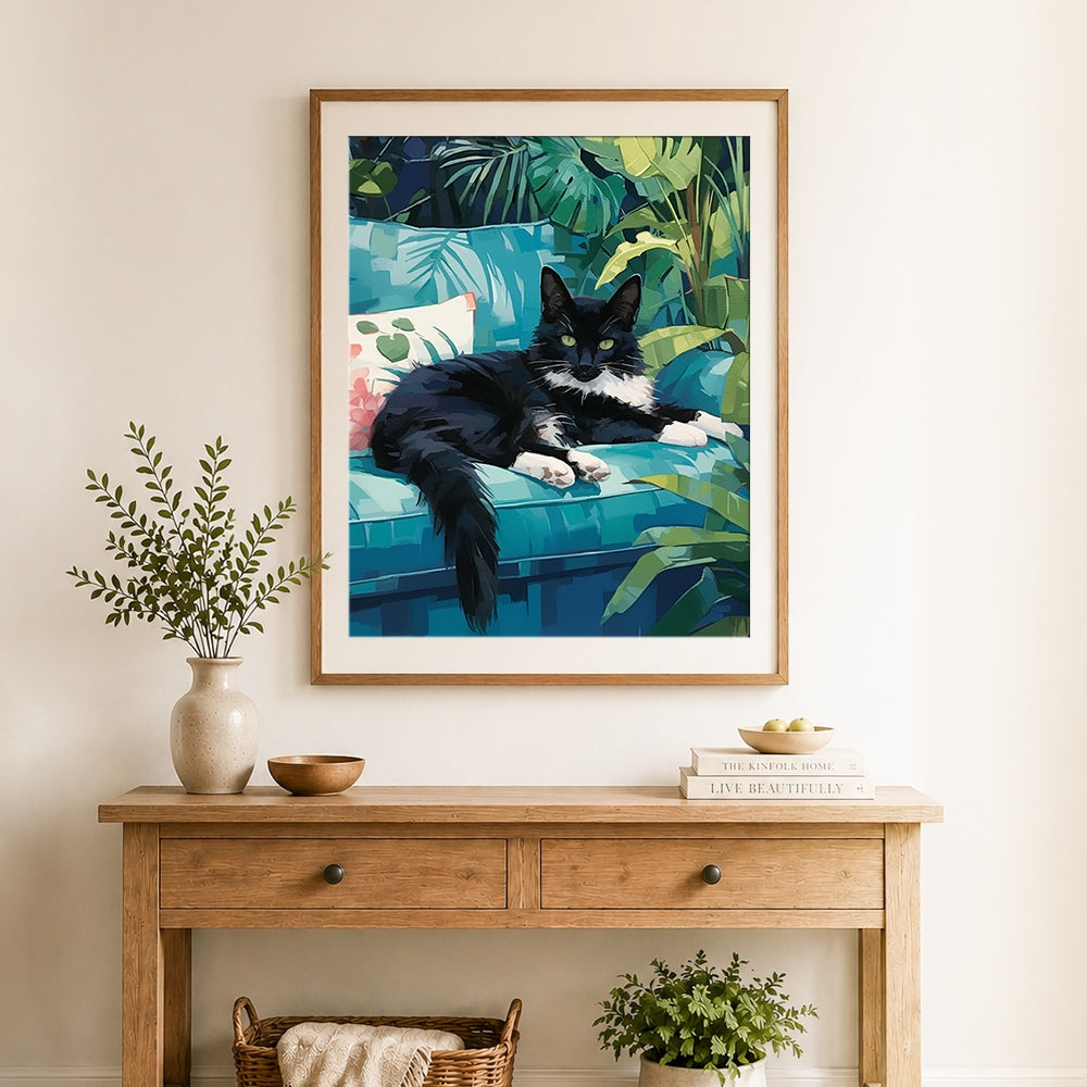 Finished cat on tropical couch cross stitch artwork displayed as home decor
