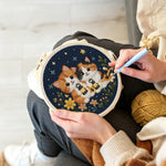 Creating handmade cats and wildflowers under the night sky punch needle artwork