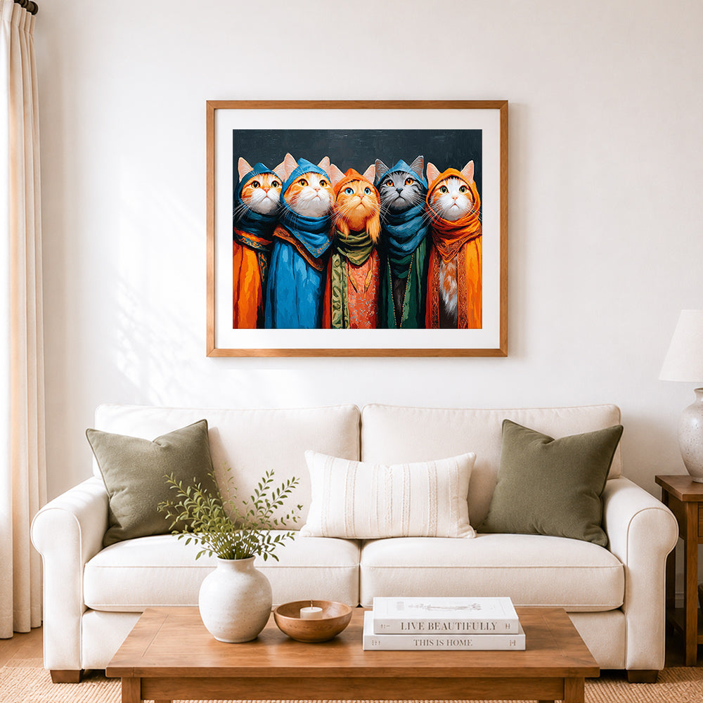 Finished cats in colorful robes cross stitch artwork displayed as home decor