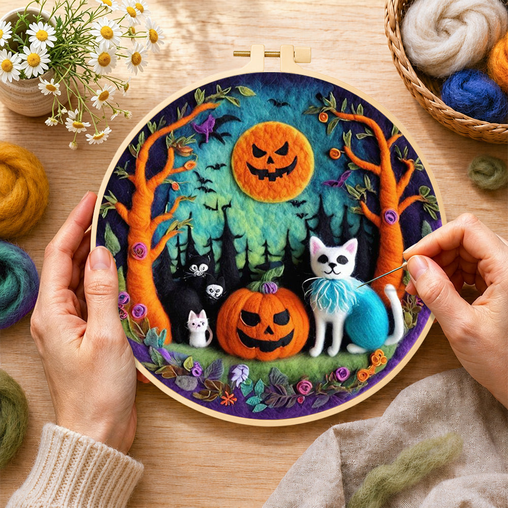Creating the cats in forest with pumpkins wool painting by hand with a felting needle