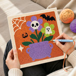 Creating handmade cauldron spooky blooms punch needle artwork