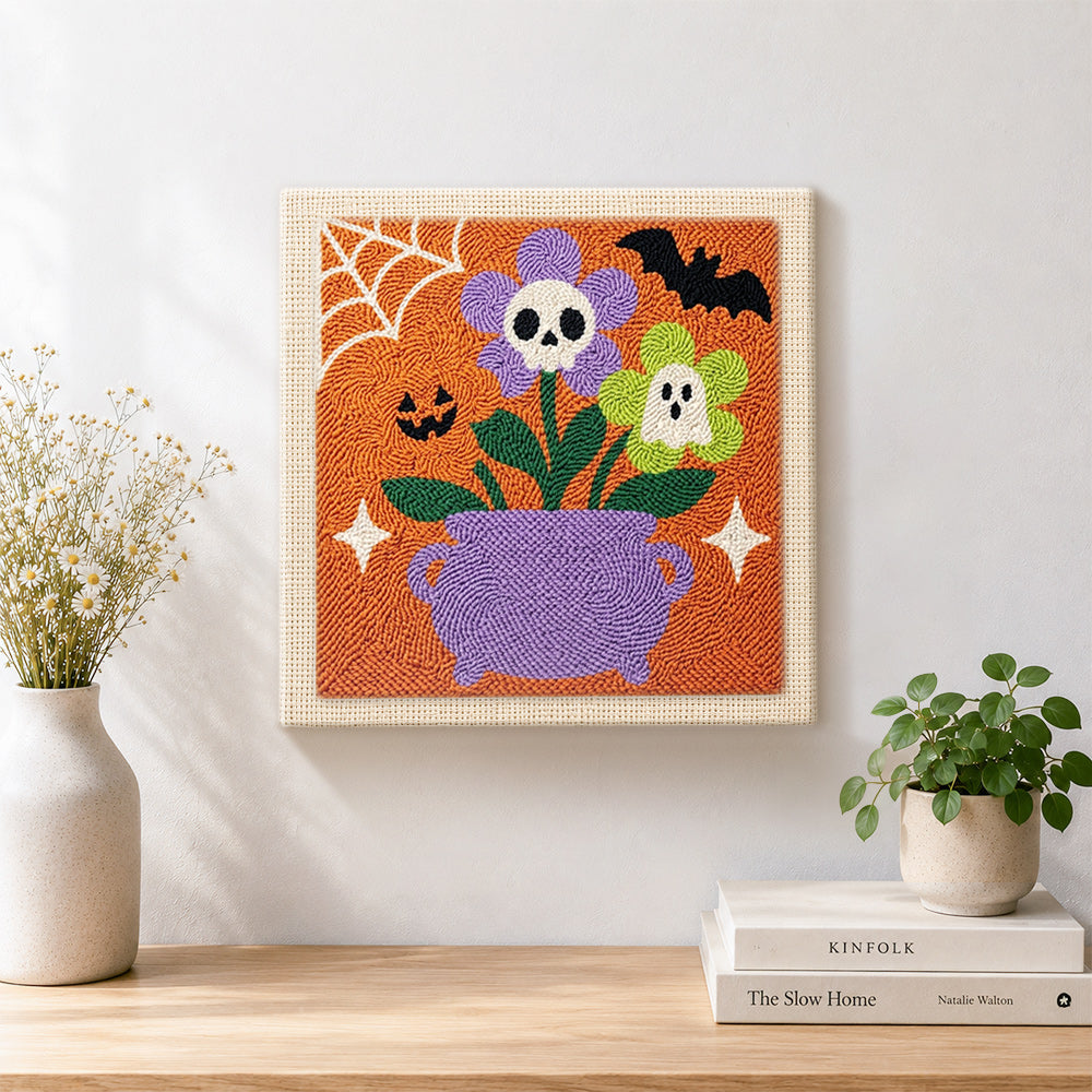Finished cauldron spooky blooms artwork displayed on a wall