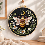 Celestial bee with daisies embroidery hoop wall art displayed as warm and cozy handmade home decor