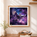 Finished celestial flying owl cross stitch artwork displayed as home decor