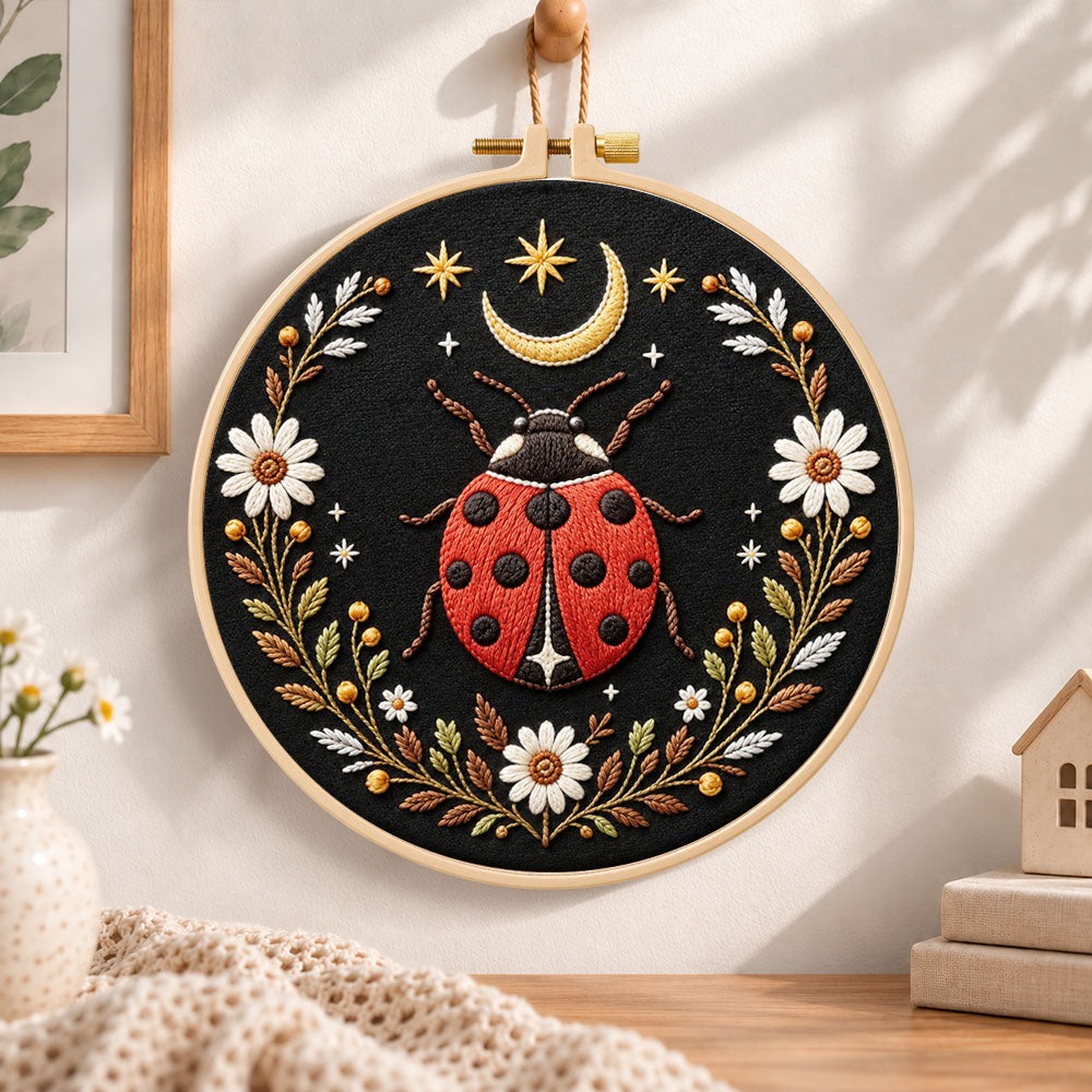Celestial ladybug embroidery hoop wall art displayed as warm and cozy handmade home decor