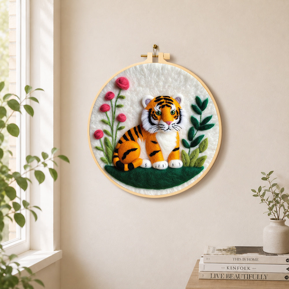 Charming little tiger needle felt wall art displayed in a bright home interior