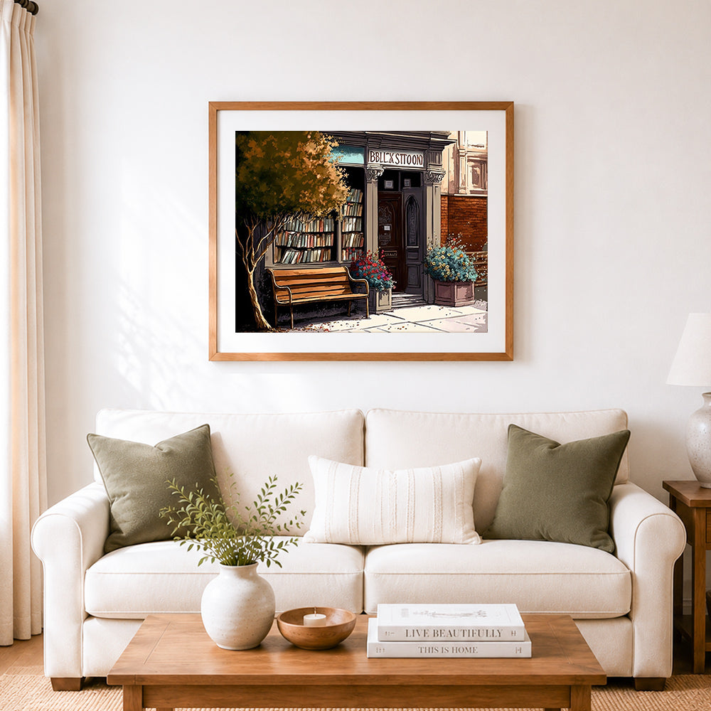 Finished charming old bookstore cross stitch artwork displayed as home decor