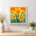 Finished cheerful yellow daffodils artwork displayed on a wall