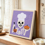 Chef skeleton punch needle artwork displayed on a table