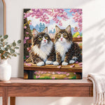 Finished cherry blossom cats pearl diamond painting artwork displayed as home decor